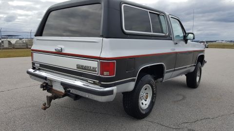 1995 Ford Bronco - This Chevrolet K5 Blazer has a two-tone paint scheme and a tow hitch installed on the rear bumper.