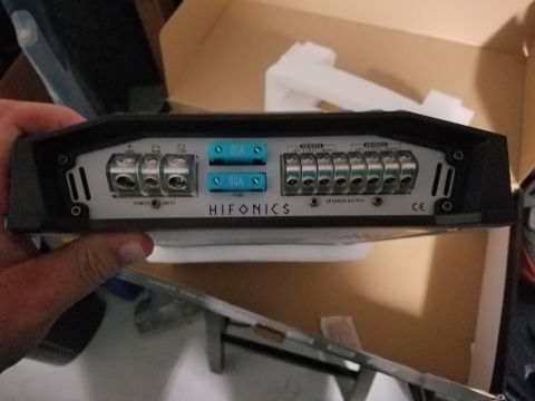 1994 Ford Bronco - A Hifonics amplifier is shown with its connection terminals and fuses clearly visible.
