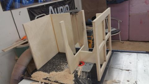1994 Ford Bronco - Wooden speaker enclosure parts are being worked on in a workshop setting.