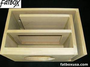 1994 Ford Bronco - A wooden subwoofer box is shown with the Supermotors logo visible.