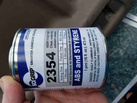 1994 Ford Bronco - A can of SciGrip 2354 adhesive is shown, with interior trim in the background.