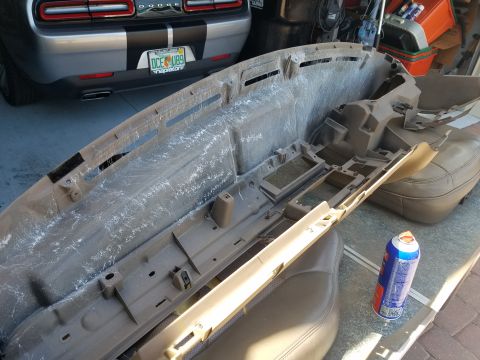 1994 Ford Bronco - Dashboard removed for repair, showing interior components and a car seat.