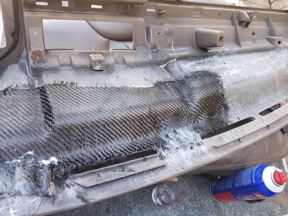 Dashboard part with carbon fiber repair and spray can