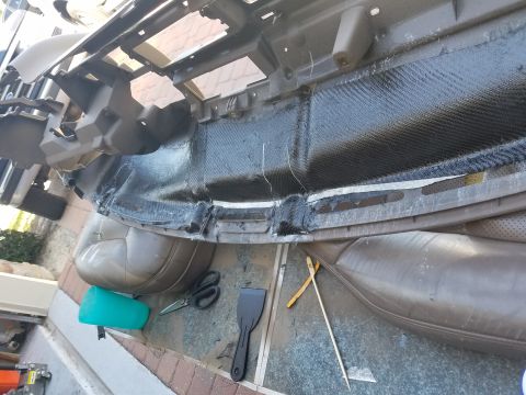 1994 Ford Bronco - Dashboard assembly undergoing repair with carbon fiber reinforcement, alongside various tools.