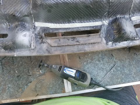 1994 Ford Bronco - Working on a custom dashboard section with a Dremel tool and cutting wheel.