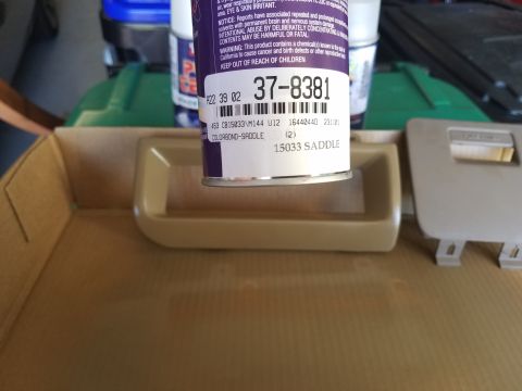 1994 Ford Bronco - Spray can with part number 37-8381 sits next to an automotive interior trim piece.