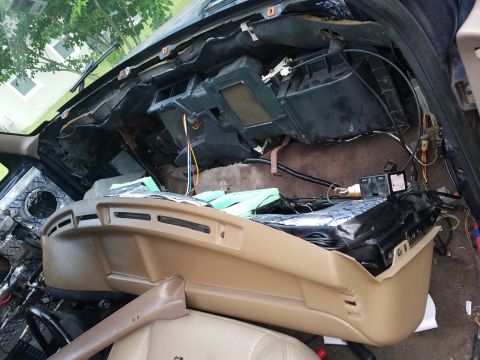 1994 Ford Bronco - Interior view of a disassembled dashboard, revealing exposed components and wiring.