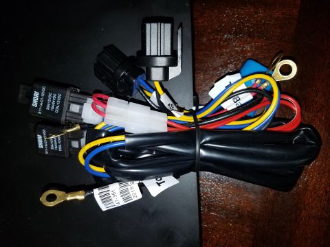1994 Ford Bronco - A close-up view of a vehicle wiring harness two relays and various connectors.