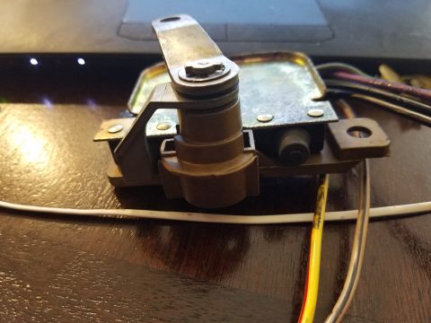 1994 Ford Bronco - This is a close-up view of a vehicle's tailgate latch mechanism, showing its internal components and wiring.