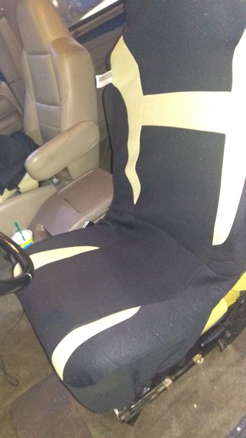 1994 Ford Bronco - Seat cover installed on a vehicle's interior seat.