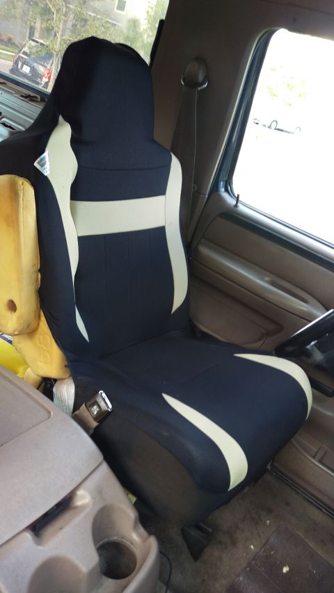 1994 Ford Bronco - Interior view of a vehicle seat with a dark blue and tan cover.