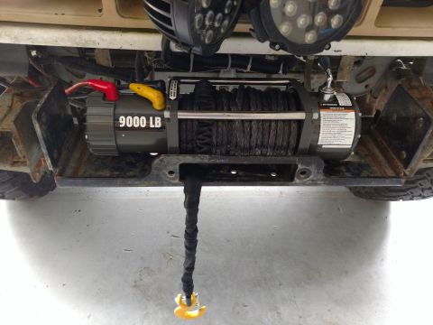 1992 Ford Bronco - Vehicle front end with a winch and auxiliary lights installed.