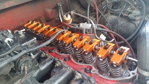 1981 Ford Bronco - Close-up view of an engine's internal components, highlighting the orange roller rocker arms.