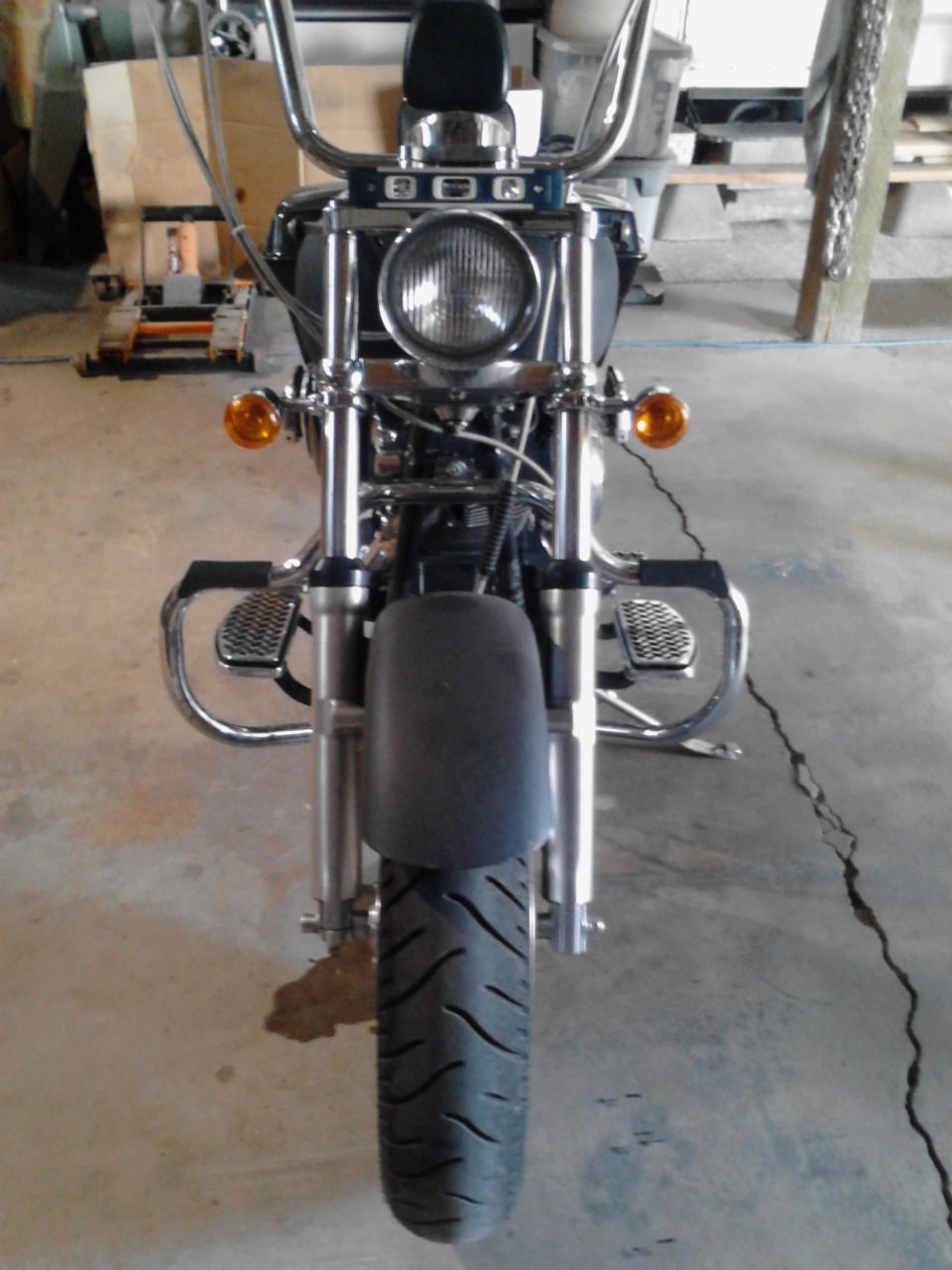 2000 Harley-Davidson Softail motorcycle front view, chrome accents, dark blue body