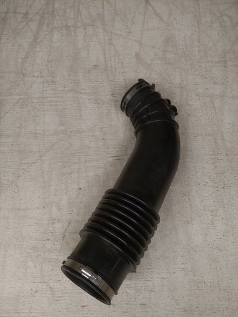 1995 Mercury Grand Marquis - Rubber air intake hose with metal clamps.