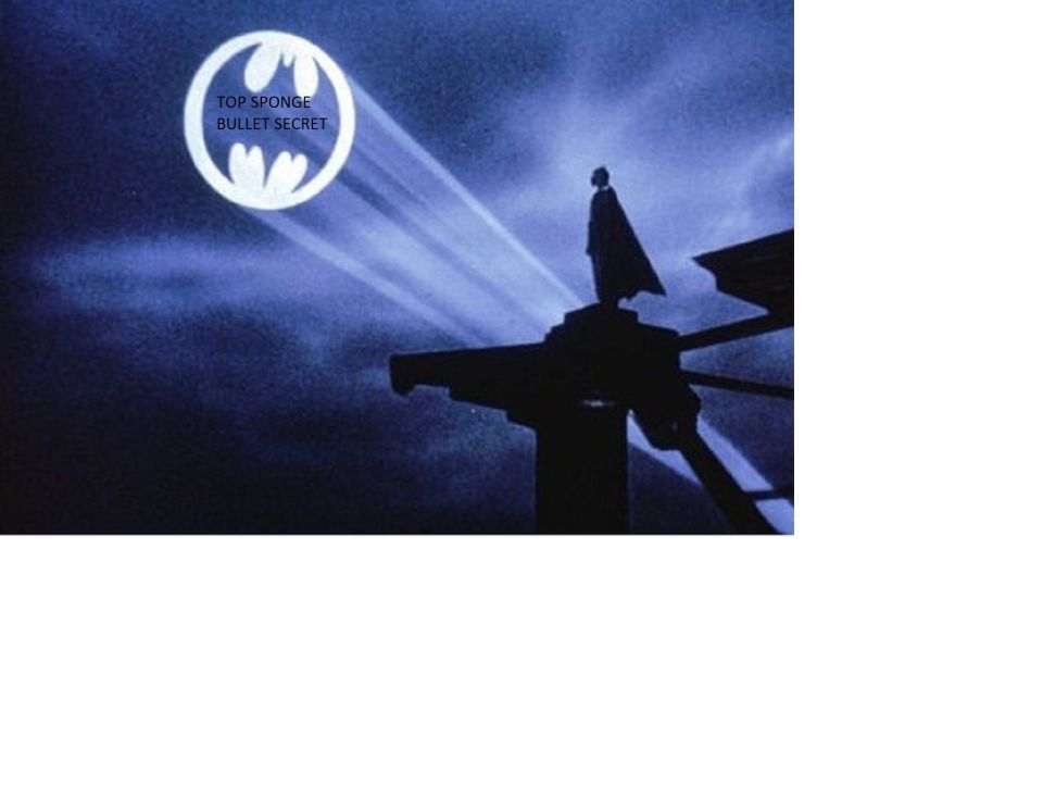 Bat-signal projected in the night sky with text overlay