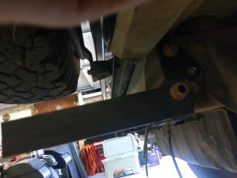 1988 Ford Bronco - A view of the vehicle's undercarriage, focusing on the spare tire and structural elements.