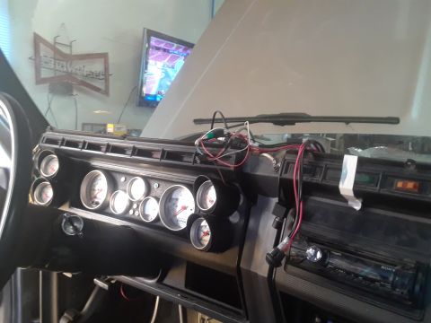 1985 Ford Bronco - The dashboard shows an array of aftermarket gauges and a Sony stereo, with wiring visible.