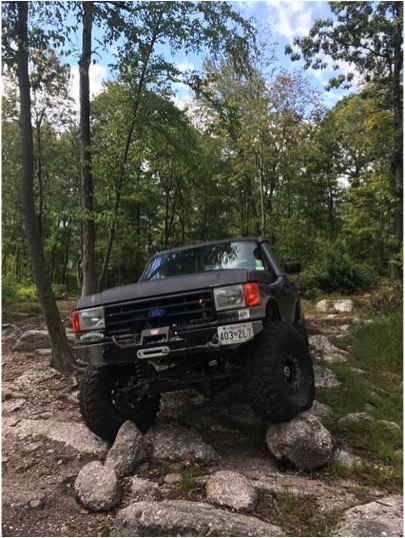 1989 Ford Bronco - Ford Bronco navigating rocky terrain off-road.