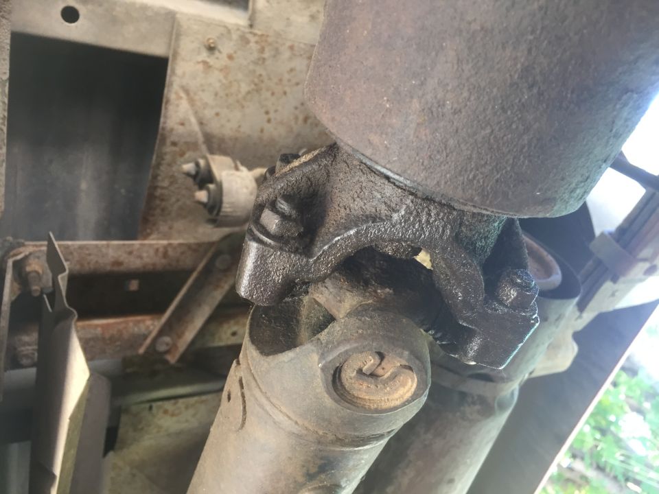 close-up of driveshaft u-joint with grease