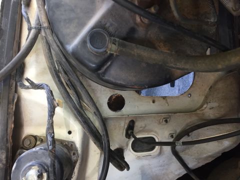 1986 Ford Bronco - This image shows a section of a vehicle's engine bay, focusing on hoses and electrical wiring.