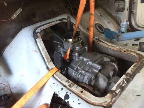 1986 Ford Bronco - Transmission installation in progress, showing the gearbox and shifter mechanism.