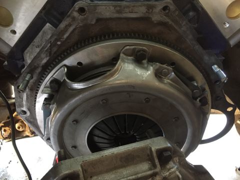 1986 Ford Bronco - Close-up view of a vehicle's clutch and flywheel assembly, showing mechanical components.