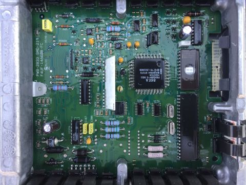 1967 Ford Custom Wagon - Close-up view of an electronic control unit's internal circuitry, showing various electronic components.