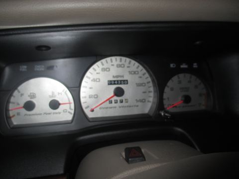 2004 Ford Crown Victoria - The dashboard gauges of a 2004 Ford Crown Victoria show an odometer reading of 94,350 miles.