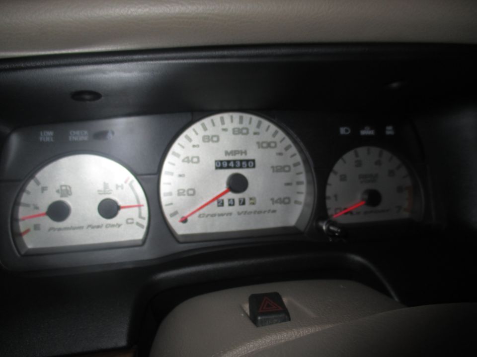 2004 Ford Crown Victoria dashboard gauges with odometer reading 094350