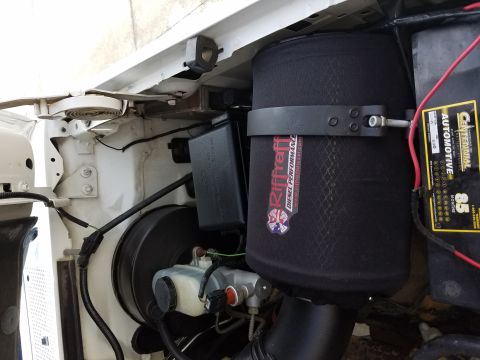 1995 Ford F-250 - Here is the filter mounted with the Donaldson M002119 air filter clamp. This keeps the filter off the fender. This was NOT included in Riff…