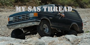 1988 Ford Bronco - This dark blue Ford Bronco navigates a rocky trail, its off-road capabilities.