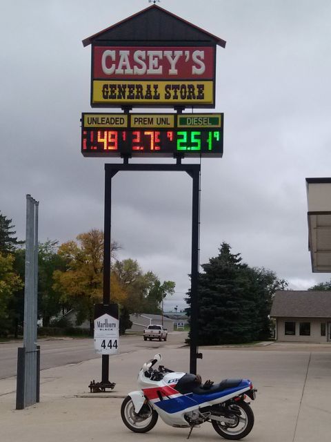 1989 Honda CBR600F - A 1989 Honda CBR600F motorcycle is parked near a Casey's General Store with gas prices displayed.