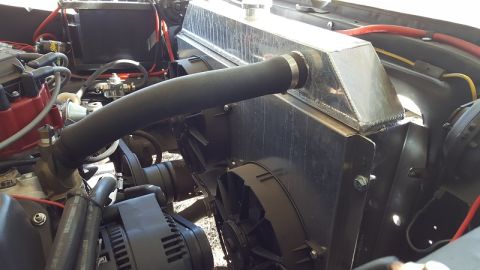 1978 Ford Bronco - Close-up view of an engine bay, highlighting the radiator and cooling fans.