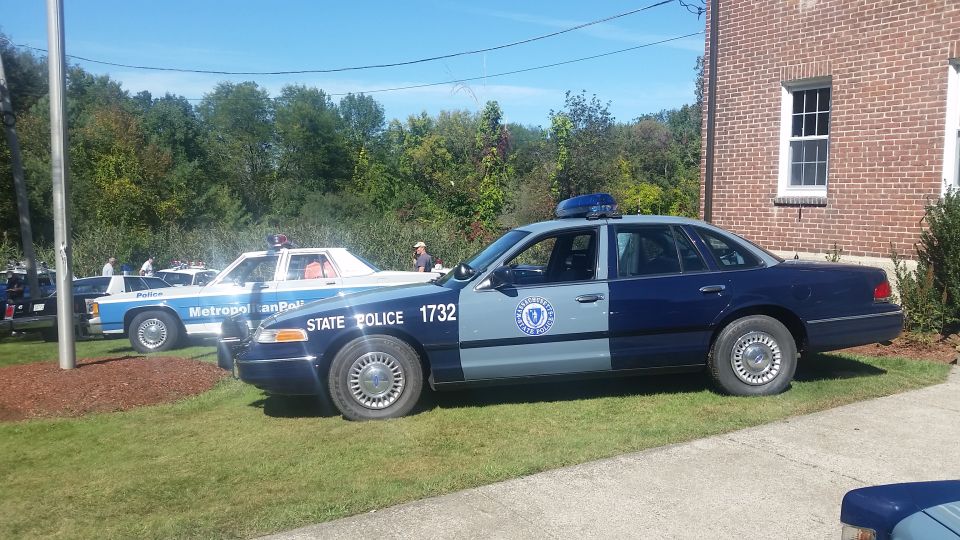1991 Ford Crown Victoria police car with "STATE POLICE 1732" on the door. Another police car is visible behind it