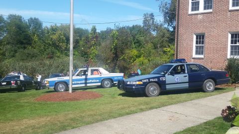 1991 Ford LTD Crown Victoria - A 1991 Ford Crown Victoria police car is parked next to another police vehicle on a sunny day.