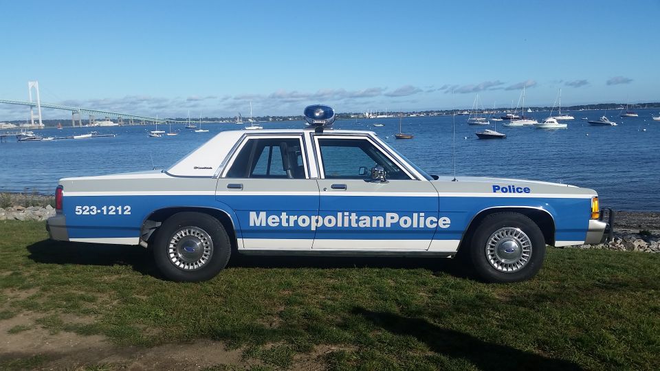 Side view of a 1991 Ford Crown Victoria police car with "Metropolitan Police" text