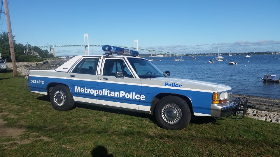 1991 Ford Crown Victoria police car, side view, blue and silver