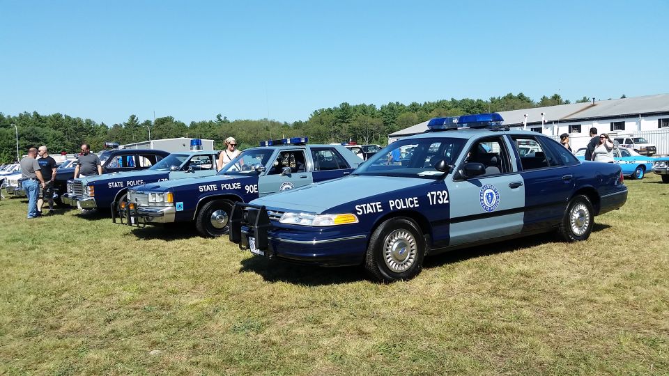 Row of Massachusetts State Police Crown Victoria cruisers at a car show