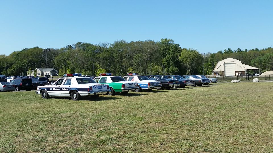 1991 Ford Crown Victoria police car, side view, white and blue