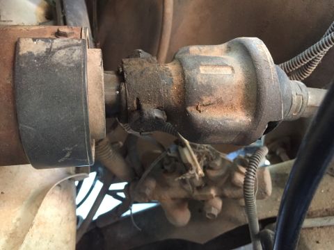 1986 Ford Bronco - Underside view of a vehicle's driveshaft and universal joint, showing mechanical components.