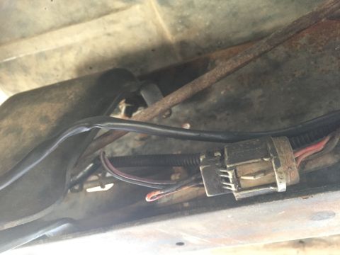 1986 Ford Bronco - Close-up view of a vehicle's underbody wiring harness connector.