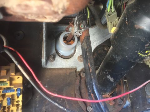 1986 Ford Bronco - Interior view shows wiring, a fuse box, and part of the steering column.