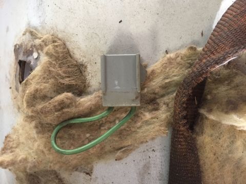 1986 Ford Bronco - Detail of automotive wiring and insulation, likely from an older vehicle's interior.