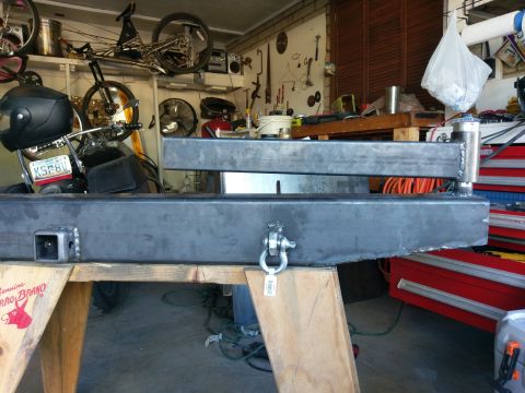 1988 Ford Bronco - A fabricated metal bumper with a hitch receiver and a D-ring shackle mount is shown in a workshop setting.