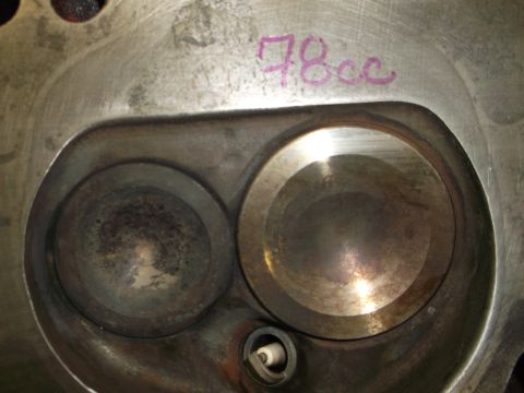1971 Ford Ranchero - Close-up of an engine cylinder head, showing two valve seats and a spark plug, with "78cc" written in purple marker.