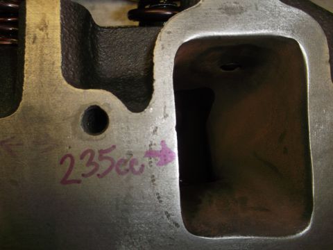 1971 Ford Ranchero - Close-up of an engine cylinder head showing '235cc' marking and an arrow.