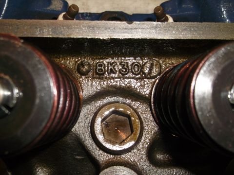 1971 Ford Ranchero - Close-up of an engine cylinder head casting showing stamped identification numbers.