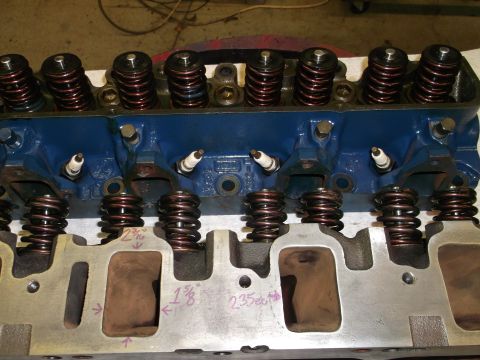 1971 Ford Ranchero - Close-up of an engine cylinder head, showing spark plugs and valve springs. Measurements are marked on the intake ports.