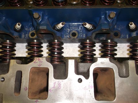1971 Ford Ranchero - Close-up view of an engine's cylinder head, showing spark plugs and valve springs.
